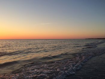 Scenic view of sea at sunset