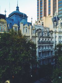 Buildings in city against sky