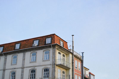 Low angle view of buildings against clear sky