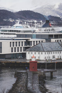 Mjolna lighthouse and cruise ship Ålesund, norway.