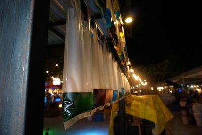 Illuminated lanterns hanging in city at night