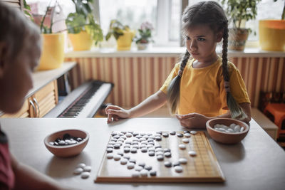 Girl playing on table