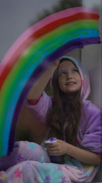 Portrait of smiling girl with multi colored hair