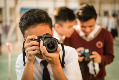 Portrait of man photographing