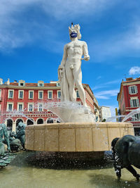 Statue of fountain against cloudy sky