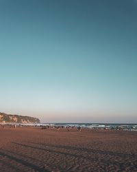 Scenic view of beach against clear sky