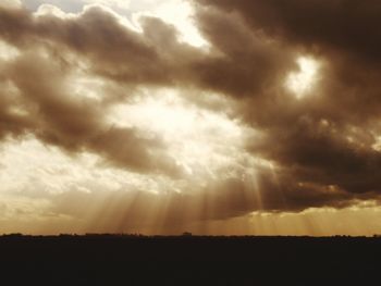 Scenic view of landscape against cloudy sky