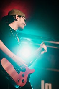 Full length of man playing guitar