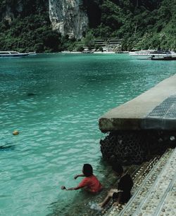 High angle view of people swimming in sea