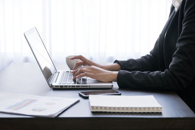 Man using laptop on table