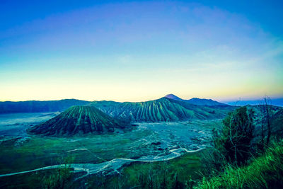 View of volcanic landscape against clear blue sky