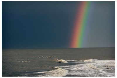 Scenic view of seascape against cloudy sky