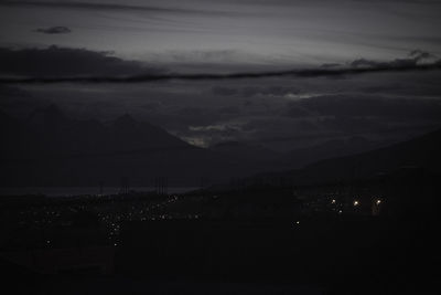 Scenic view of silhouette mountain against sky at night