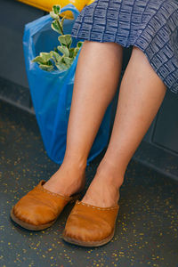 Low section of woman sitting