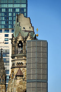  ruins of the memorial church in memory of the second world war front of high-rise building 