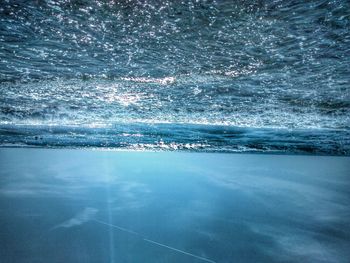 Scenic view of sea against blue sky