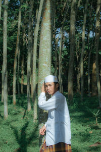 Portrait of man muslim standing in forest