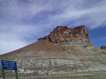 Scenic view of mountain against cloudy sky