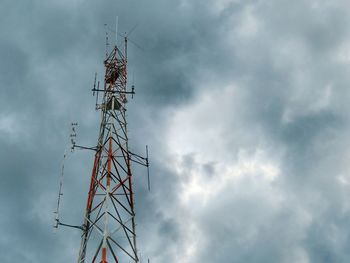 Low angle view of communications tower against sky