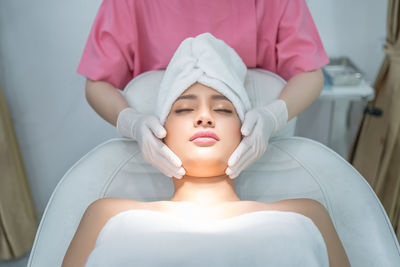 Midsection of a woman with eyes closed