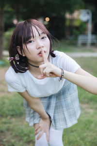 Student wearing school uniform while standing in park