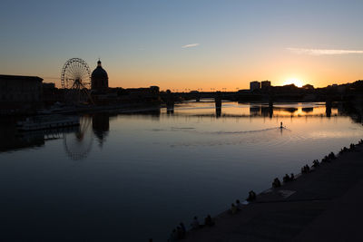 Silhouette of buildings at waterfront