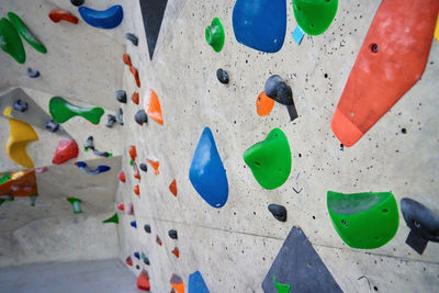 Bouldering gym with artificial colourful rock wall