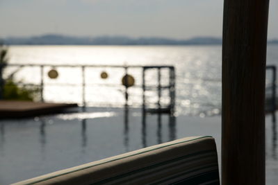 Close-up of railing against sea