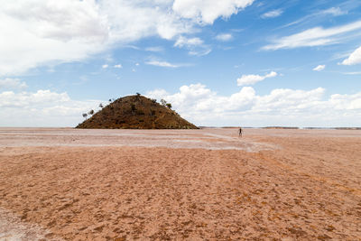 Scenic view of sandy beach against sky