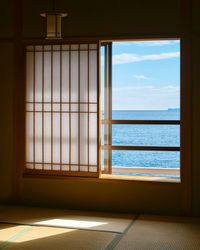 Sea seen through window at home