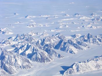 High angle view of snowcapped mountains against sky