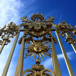 Low angle view of sculpture against blue sky