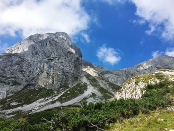 Scenic view of rocky mountains against blue sky