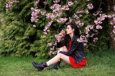 Young woman sitting on field