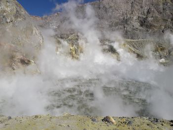 Smoke emitting from volcanic mountain