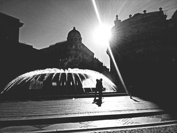 Sun shining through building