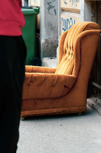 Low section of man sitting on chair