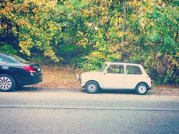 Side view of car parked on road