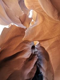 Low angle view of rock formation against sky