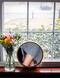 Flower vase on window sill