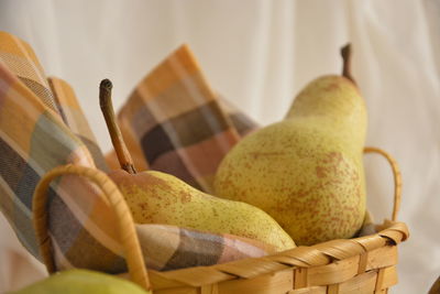 Close-up of pears in basket