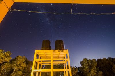 Low angle view of built structure against sky at night