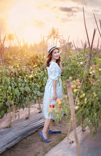 Full length of woman standing on field