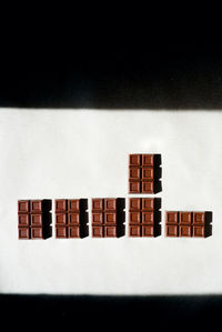 Close-up of piano against black background