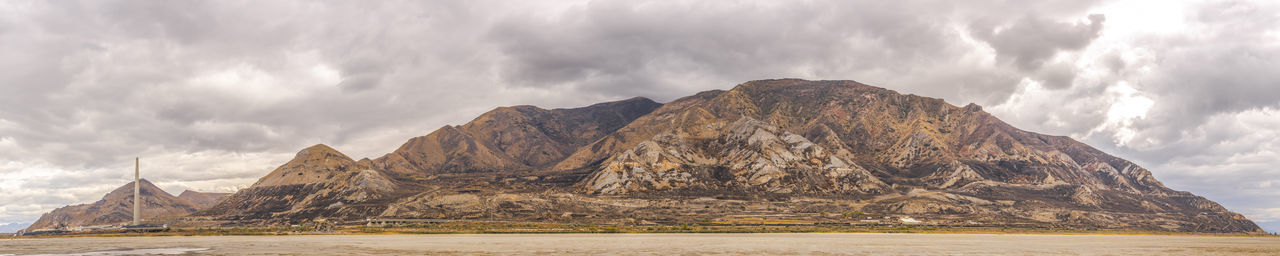 Panoramic view of rock formations against sky