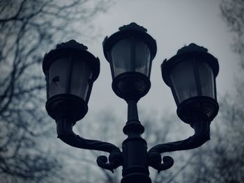 Low angle view of street light against sky