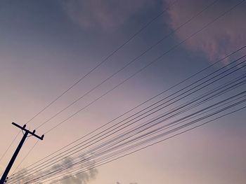 Low angle view of electricity pylon against sky