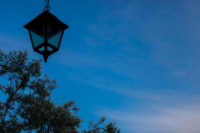 Low angle view of basketball hoop against blue sky