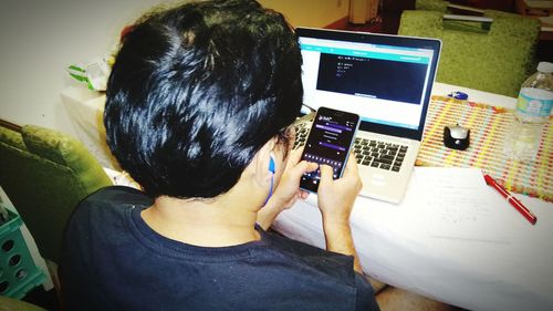 High angle view of woman using mobile phone