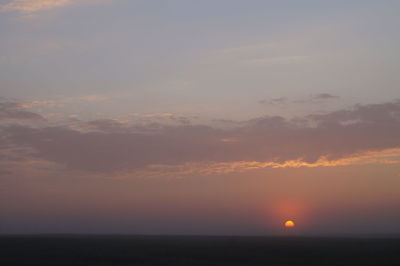 View of calm sea at sunset